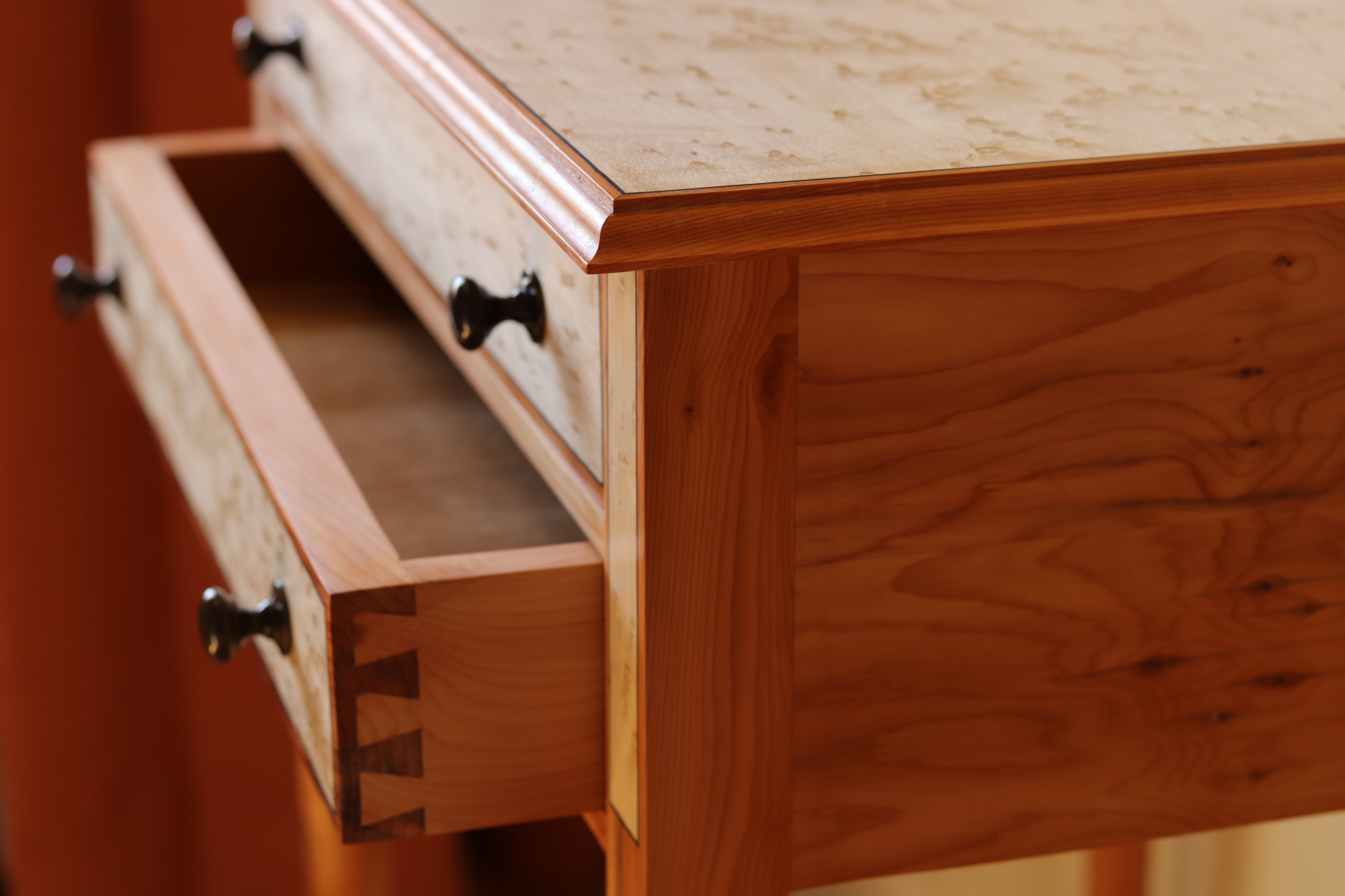 Detailed view of Federal style writing desk showcasing birds-eye maple and yew wood with turned legs by Grillo & Co